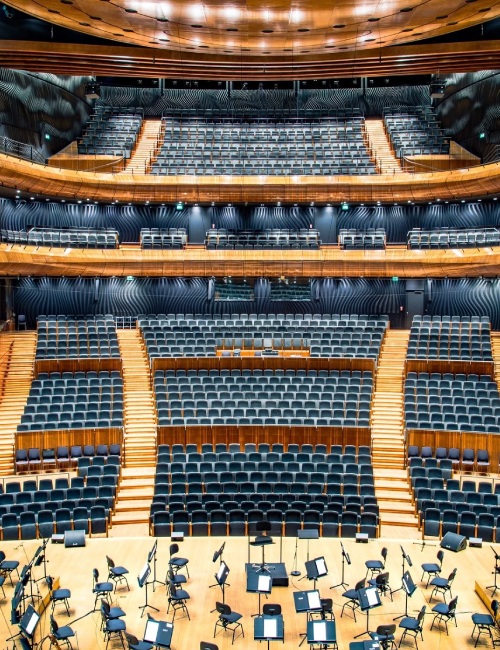 A large auditorium with many rows of seats.