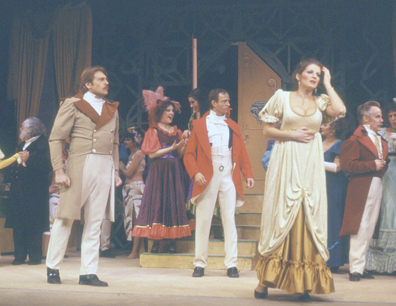 A group of people standing on top of a stage.